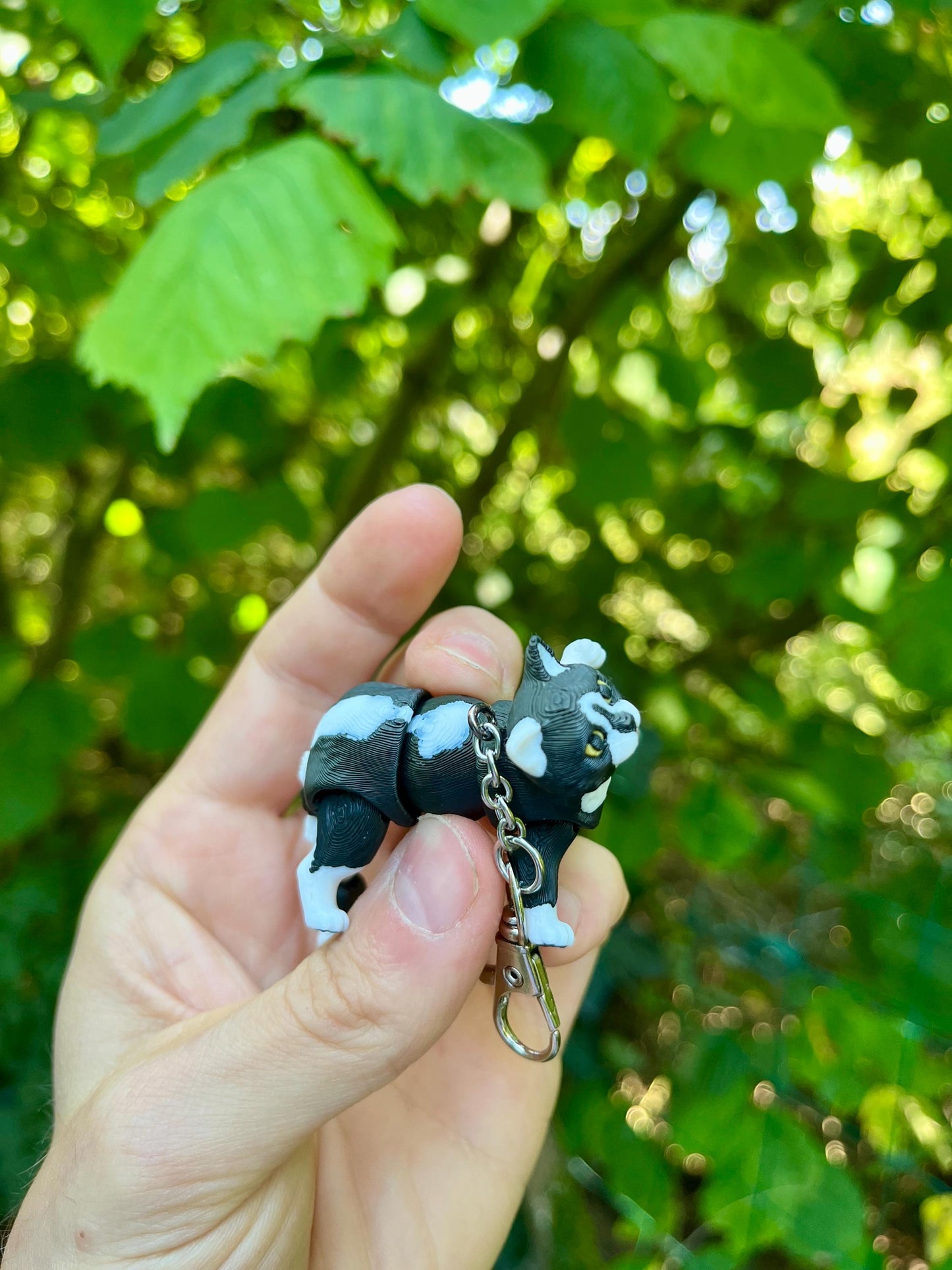 Articulated tuxedo cat keychains