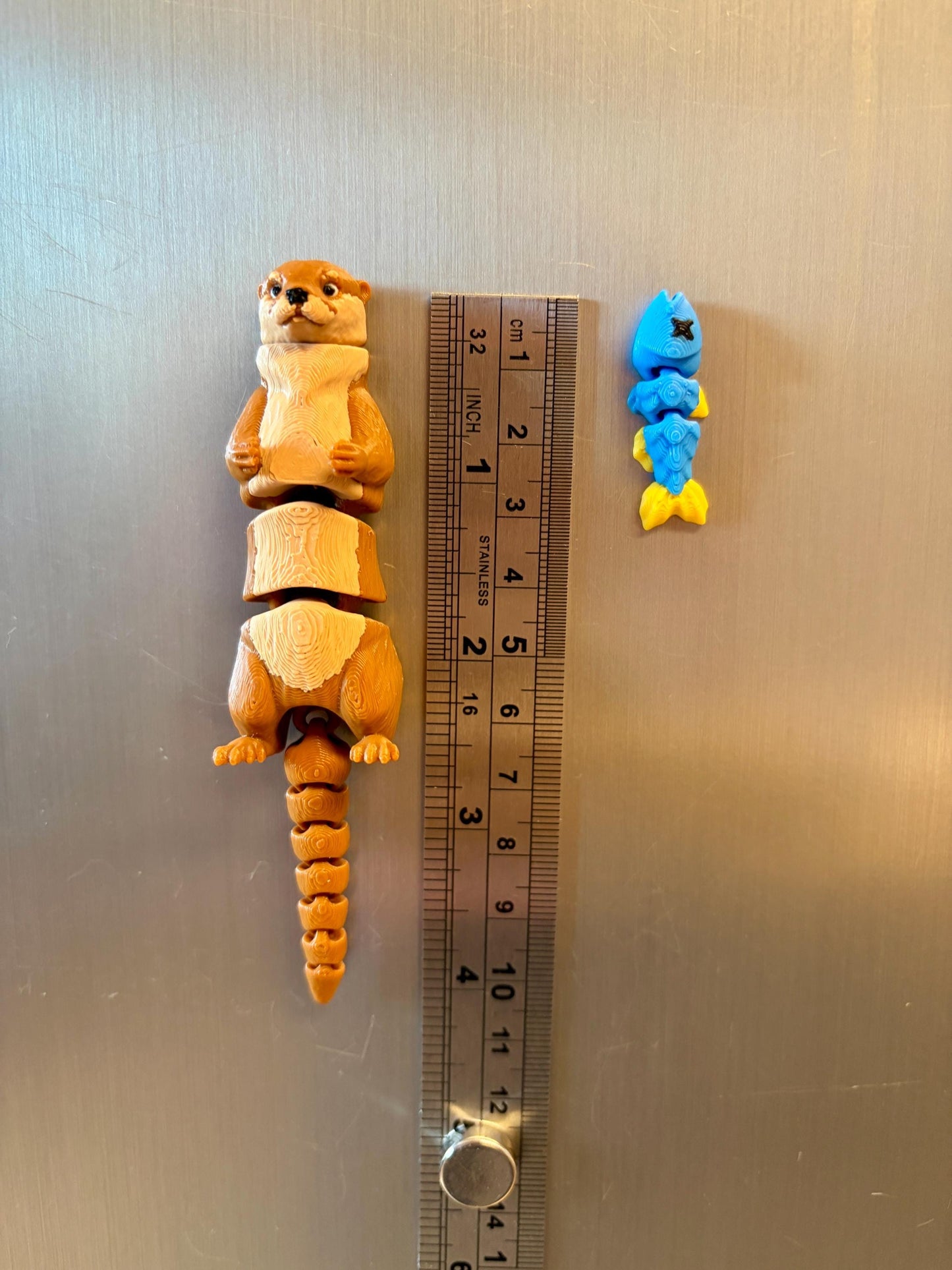 Articulated otter fridge magnet