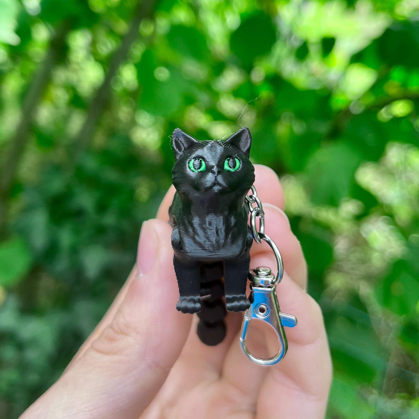 Articulated black cat keychain