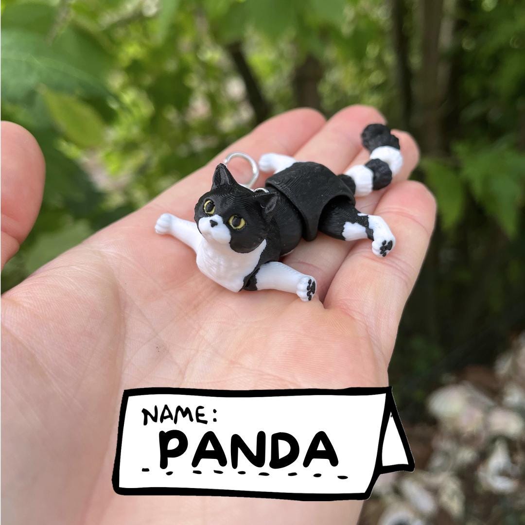 Articulated tuxedo cat keychains