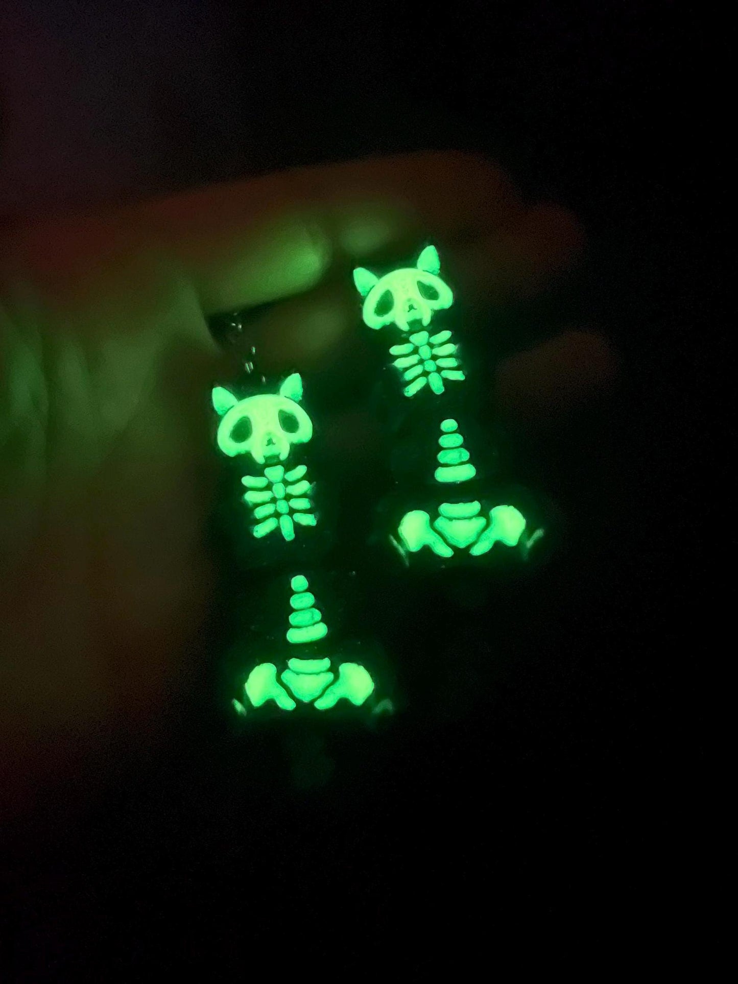 Glow-in-the-dark articulated skeleton cat keychain