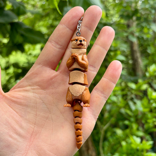Articulated otter keychain