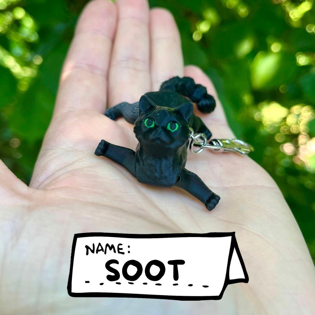 Articulated black cat keychain