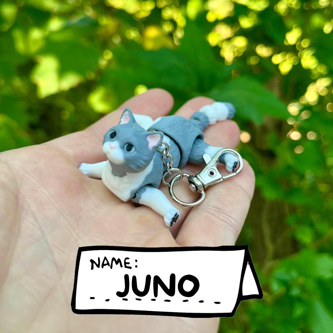 Light grey articulated cat keychains