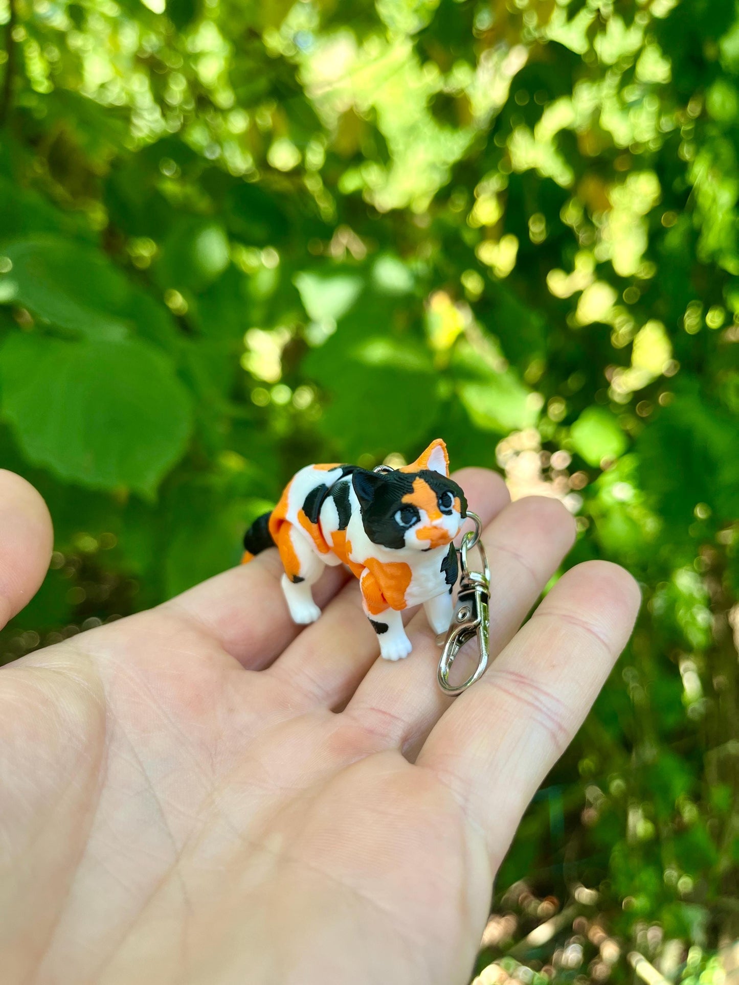 Articulated calico cats keychains