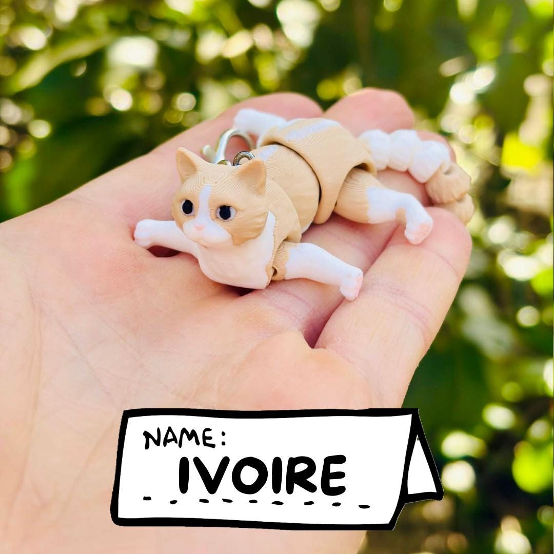 Articulated beige cat keychains