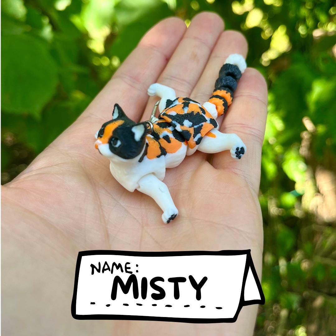 Articulated calico cats keychains