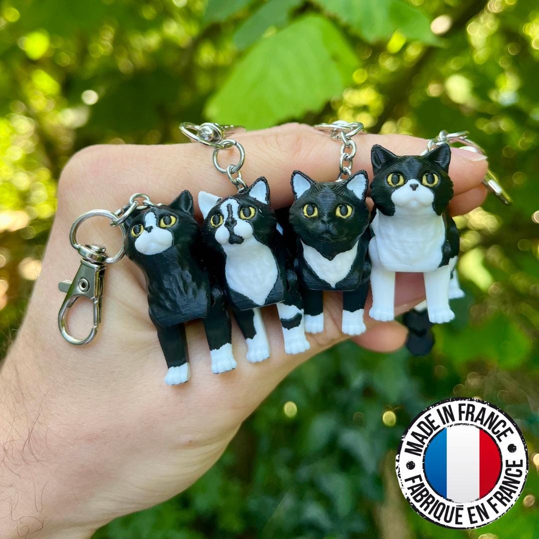 Articulated tuxedo cat keychains