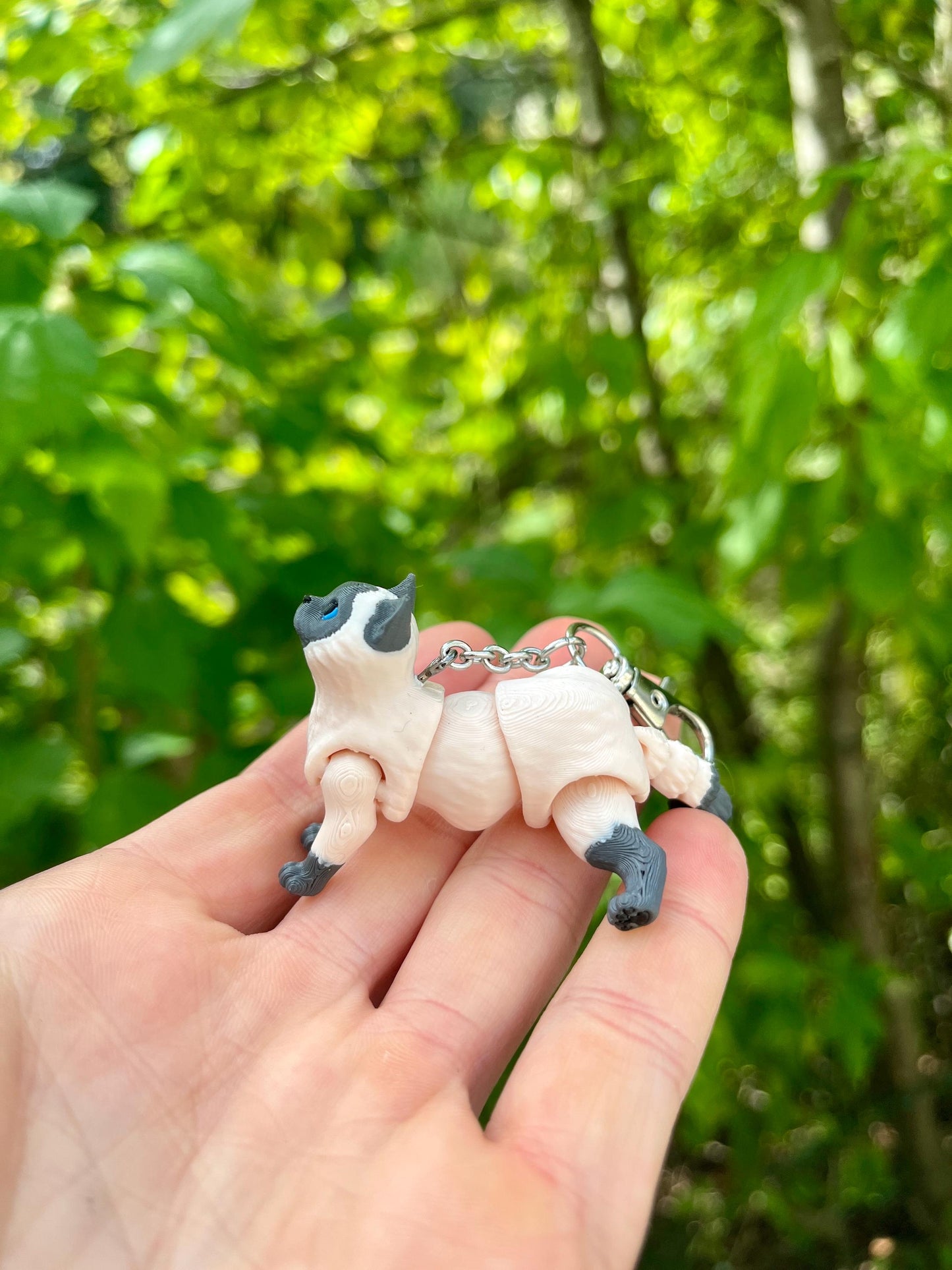 Articulated grey Siamese cat keychain