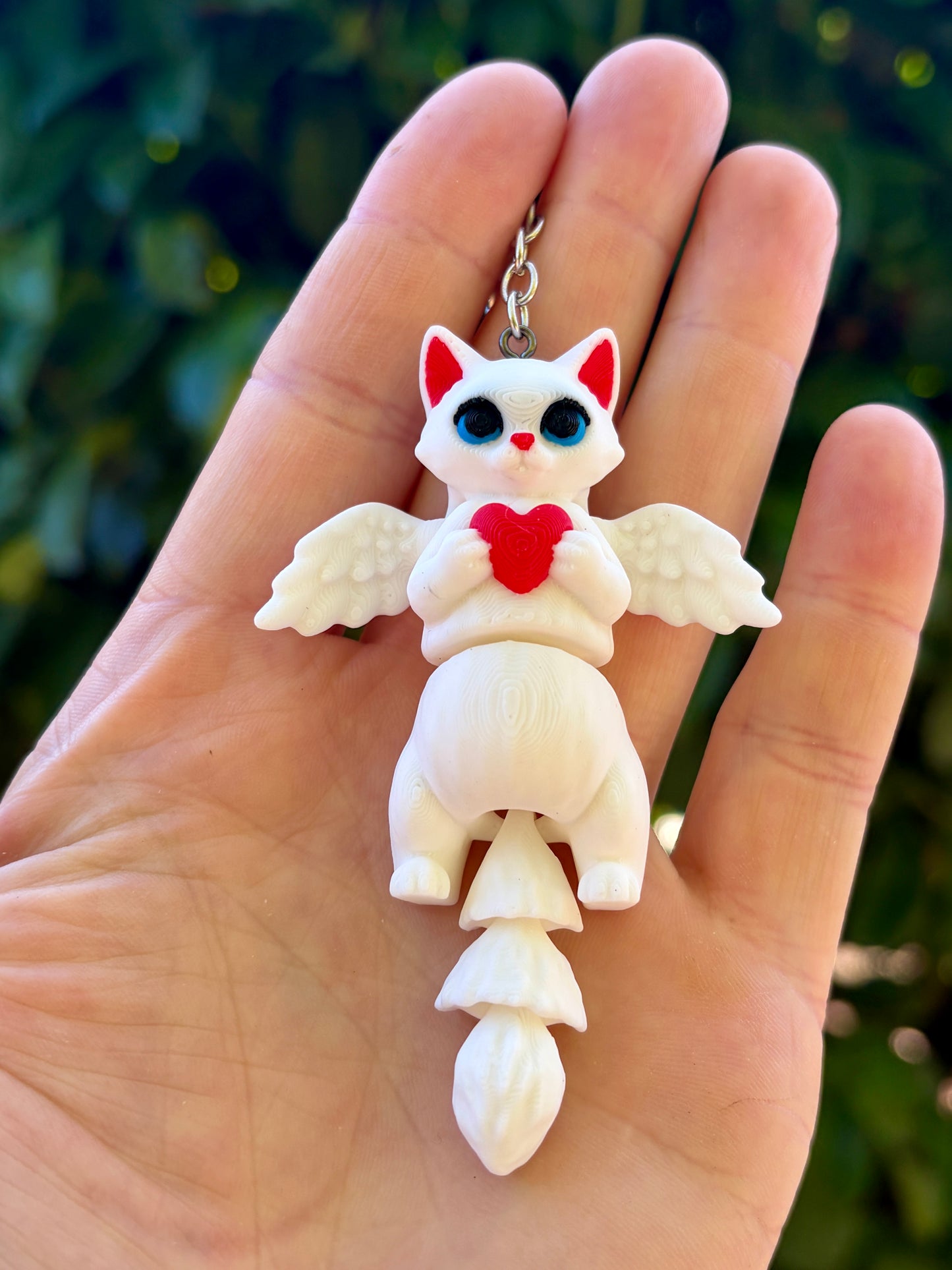 Porte-clés chats ailés articulés
