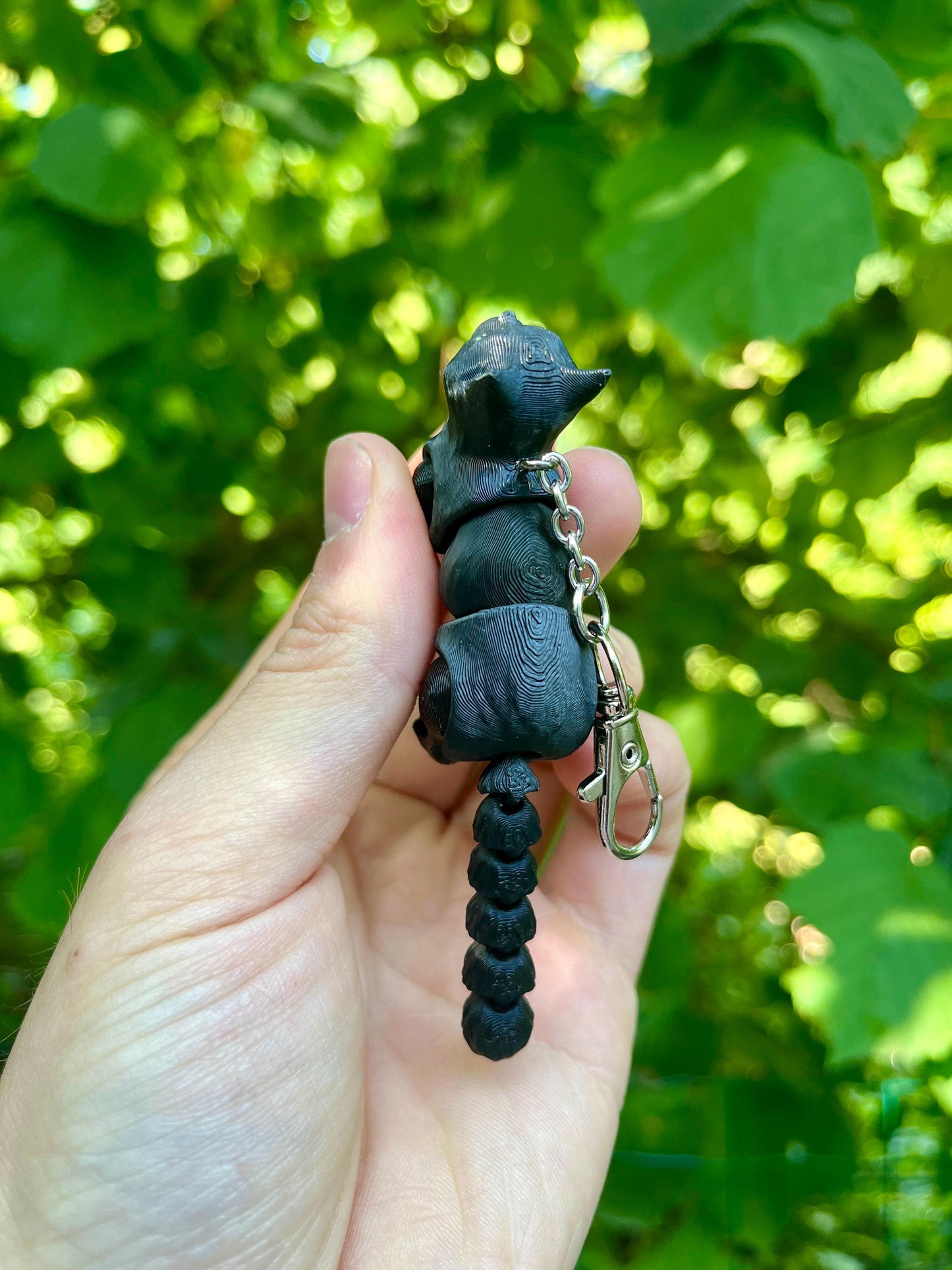 Articulated black cat keychain