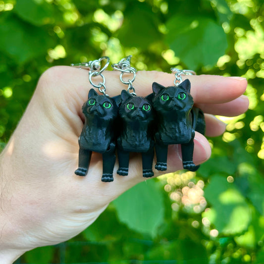 Articulated black cat keychain