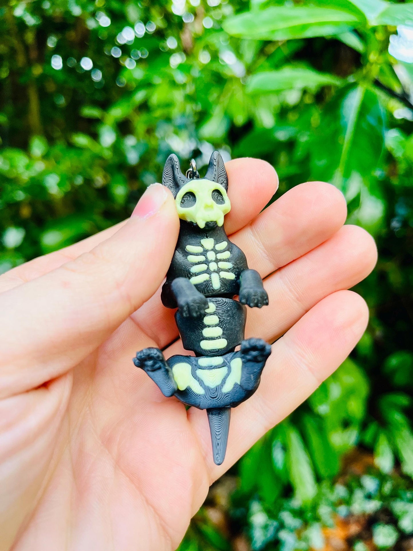 Glow-in-the-dark articulated skeleton dog keychain