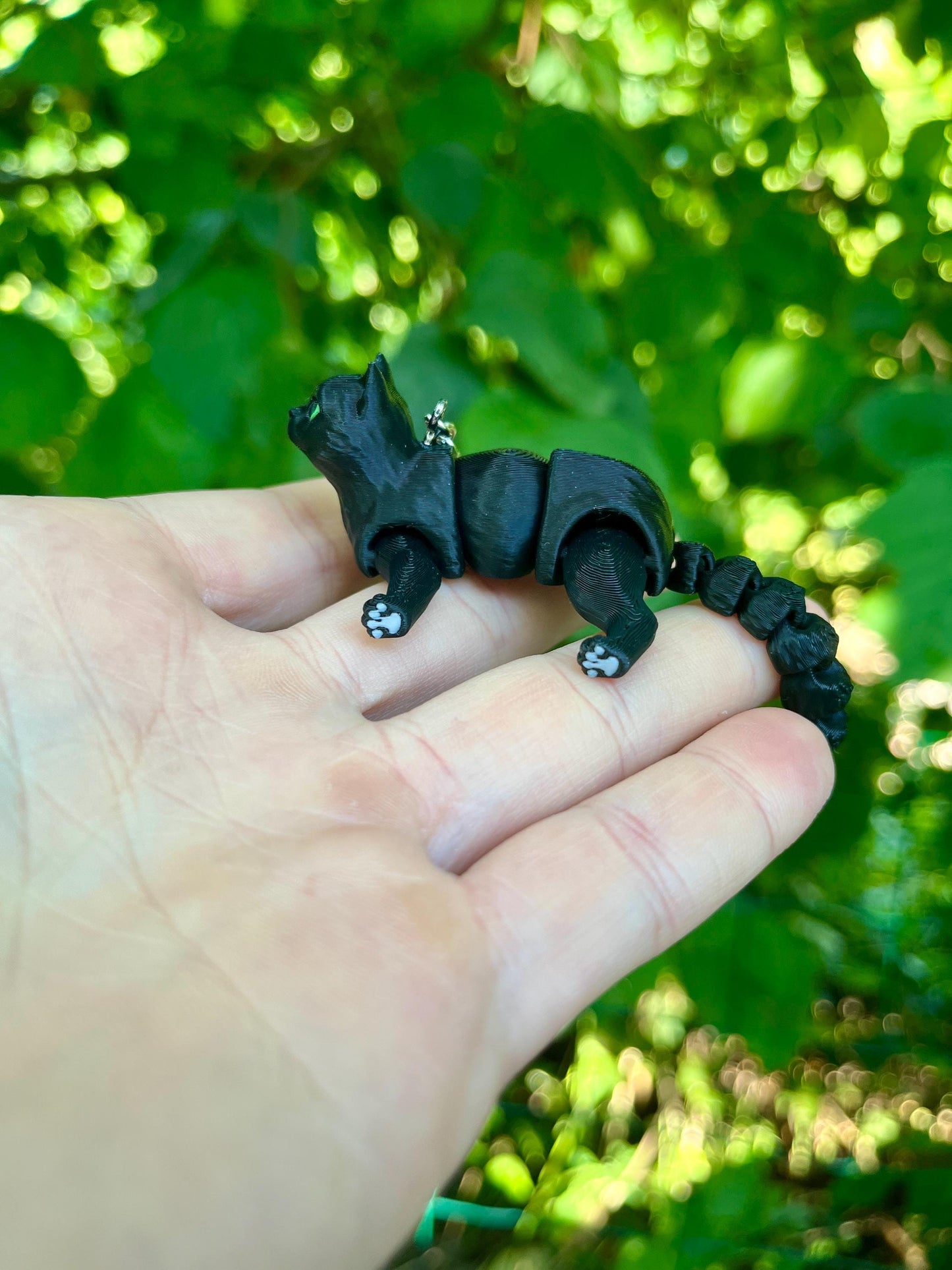 Articulated black cat keychain