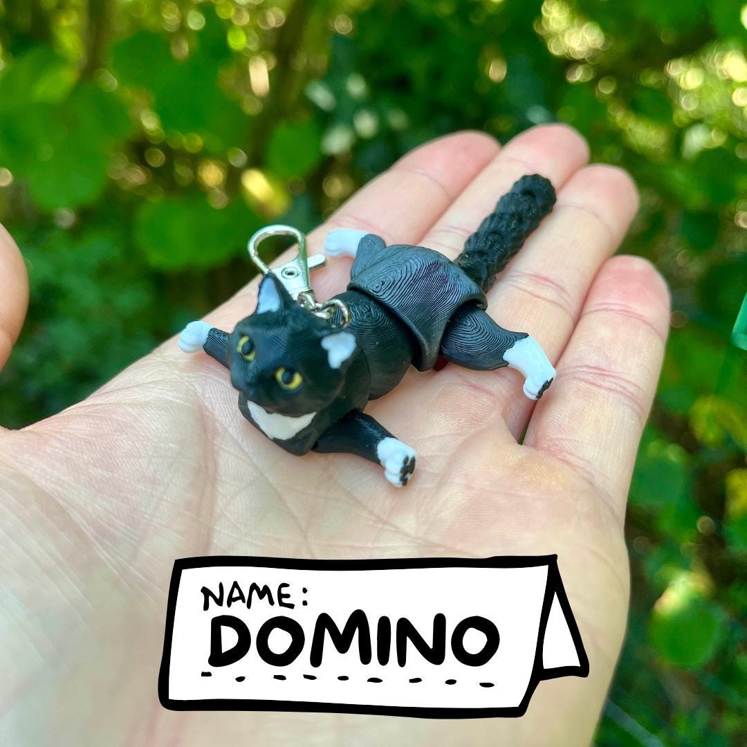 Articulated tuxedo cat keychains