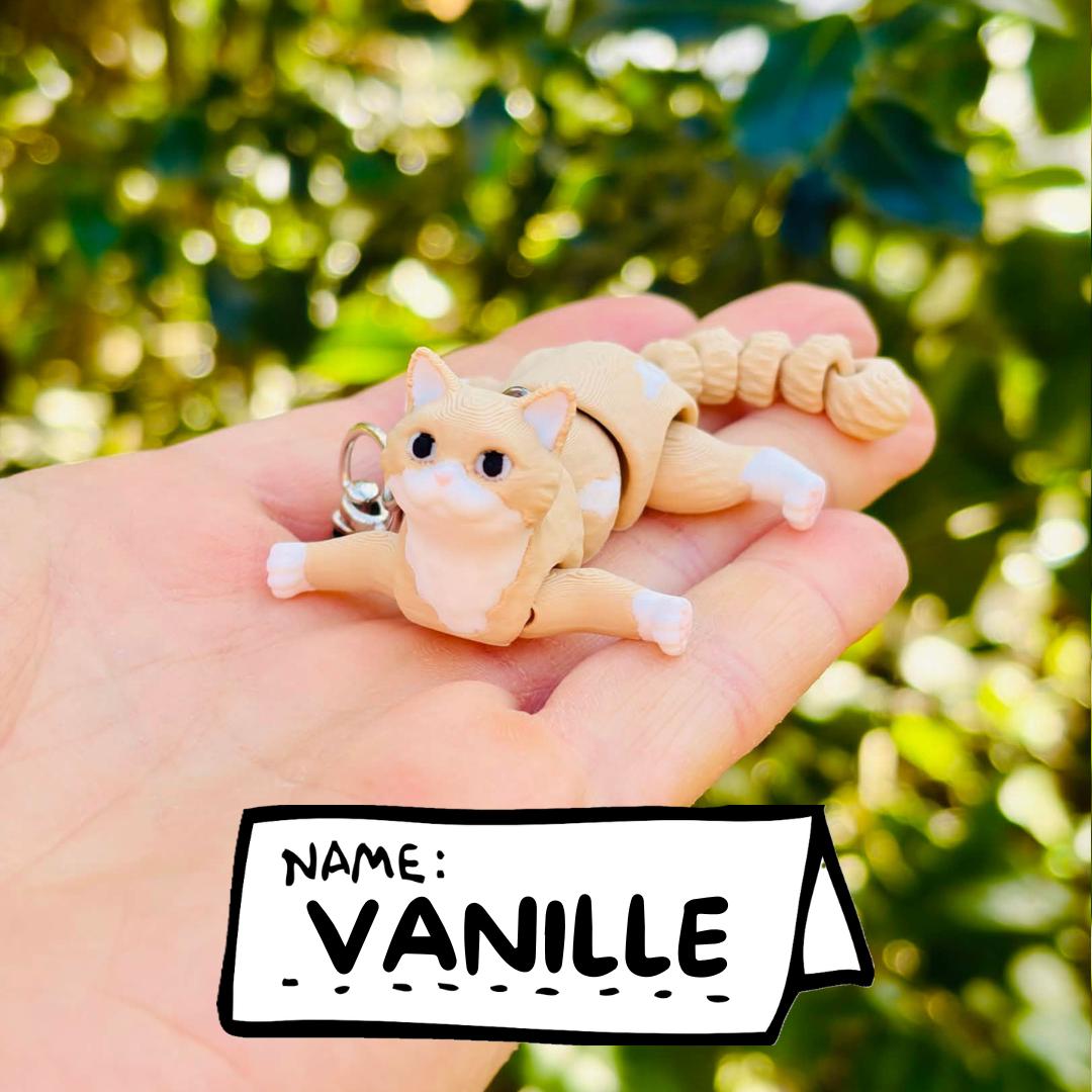 Articulated beige cat keychains