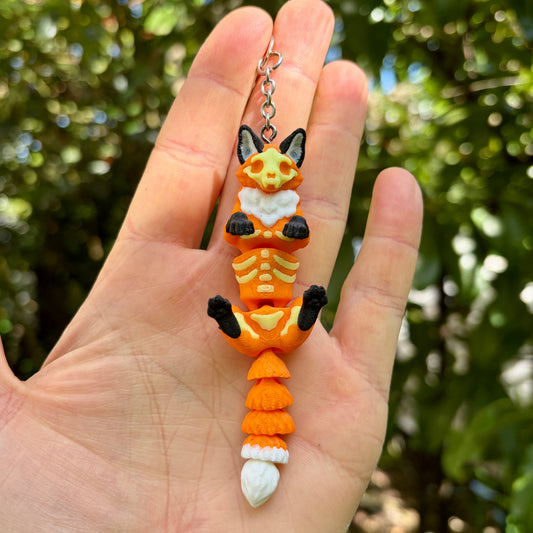 Articulated glow-in-the-dark skeleton fox keychain