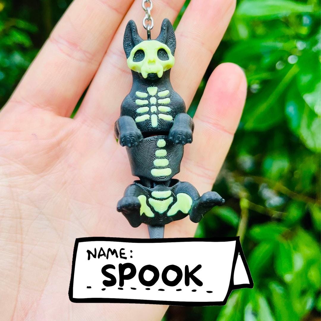 Glow-in-the-dark articulated skeleton dog keychain