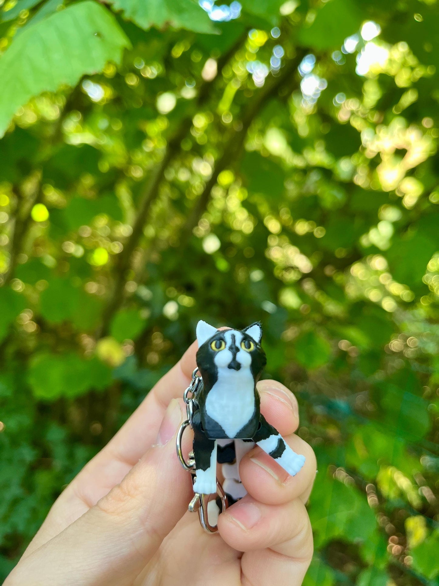 Articulated tuxedo cat keychains