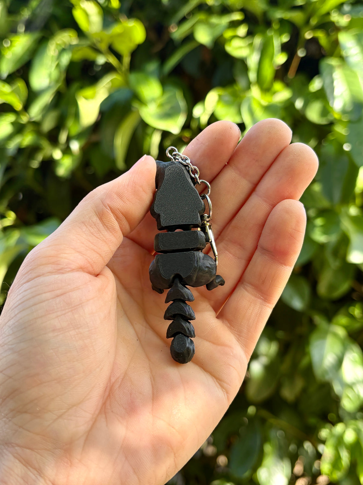 Glow-in-the-dark articulated skeleton cat keychain