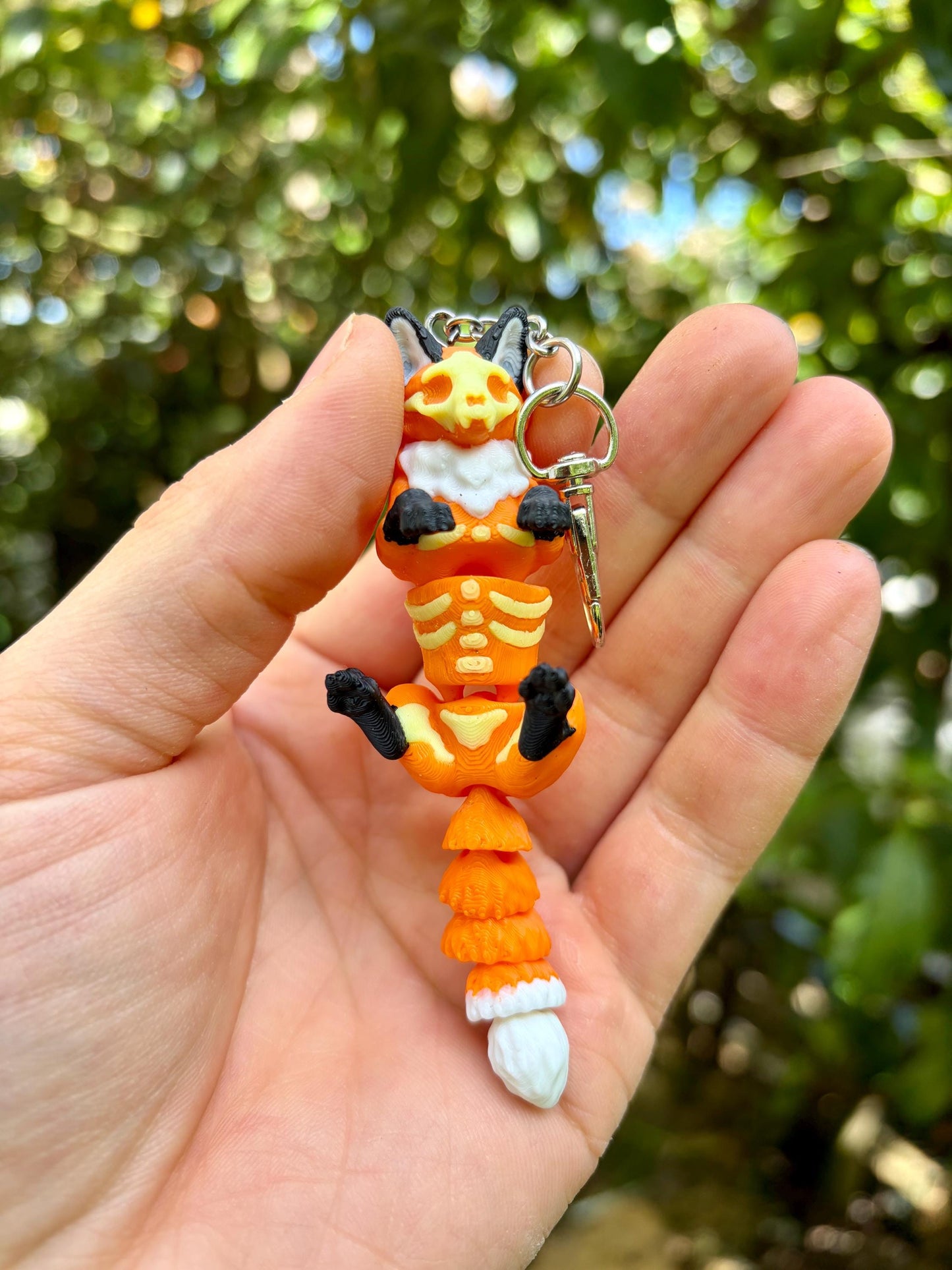 Articulated glow-in-the-dark skeleton fox keychain