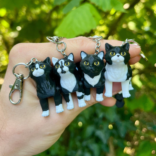 Articulated tuxedo cat keychains