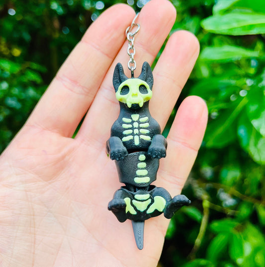 Glow-in-the-dark articulated skeleton dog keychain