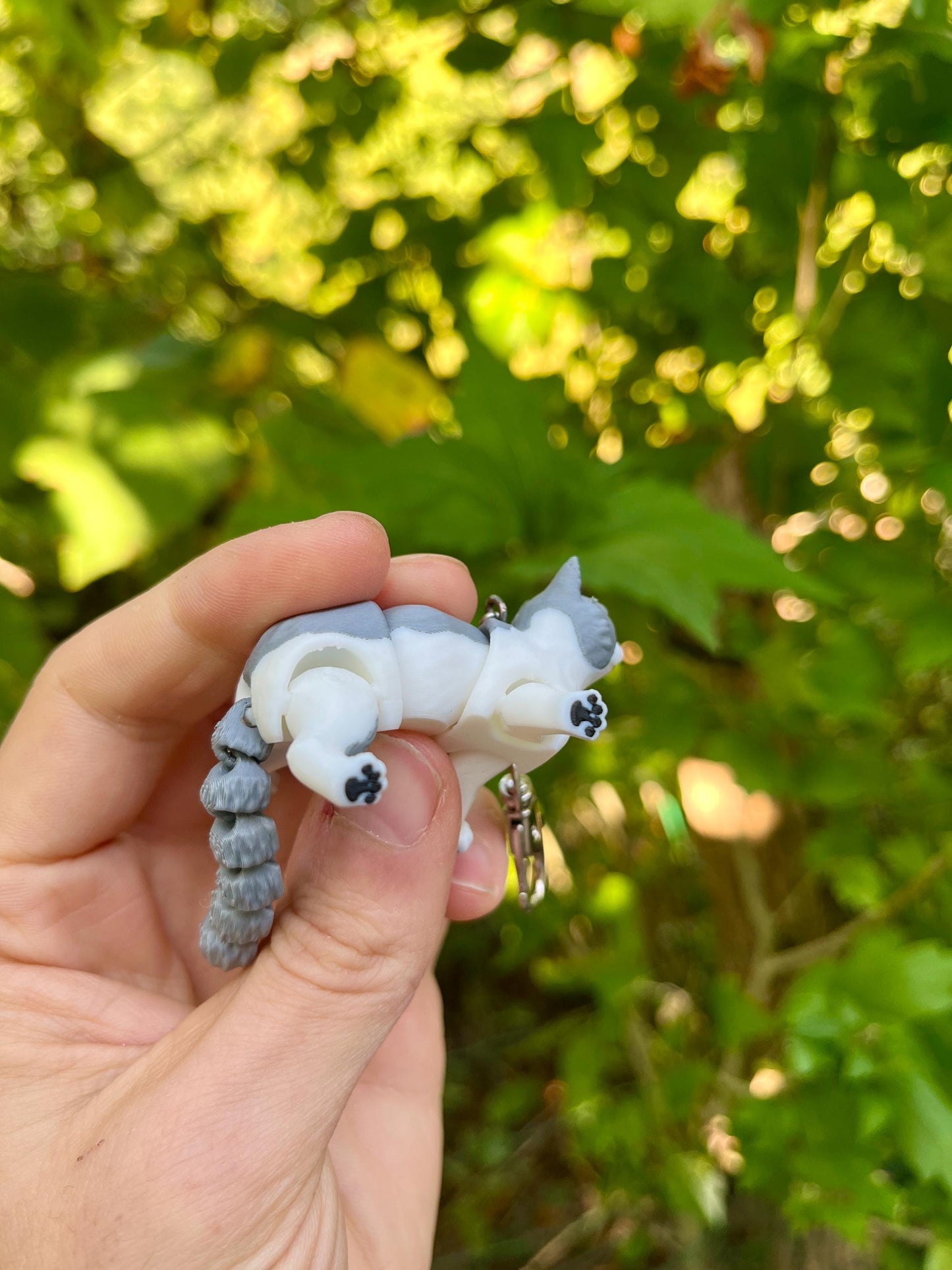 Light grey articulated cat keychains