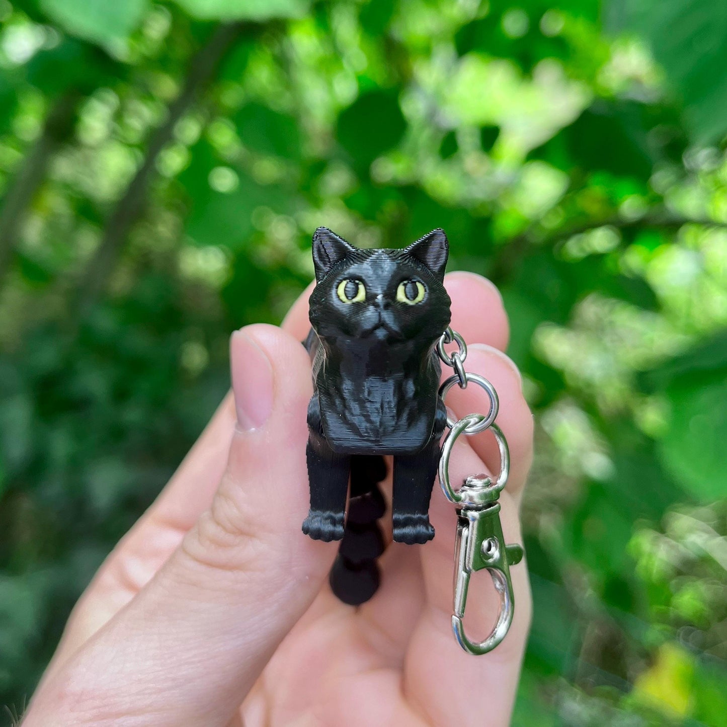 Articulated black cat keychain