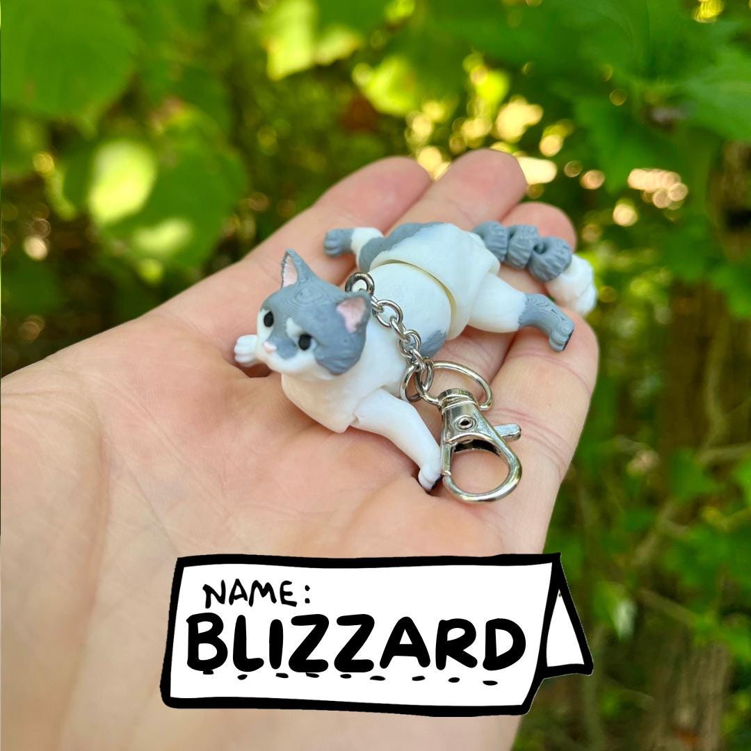 Light grey articulated cat keychains