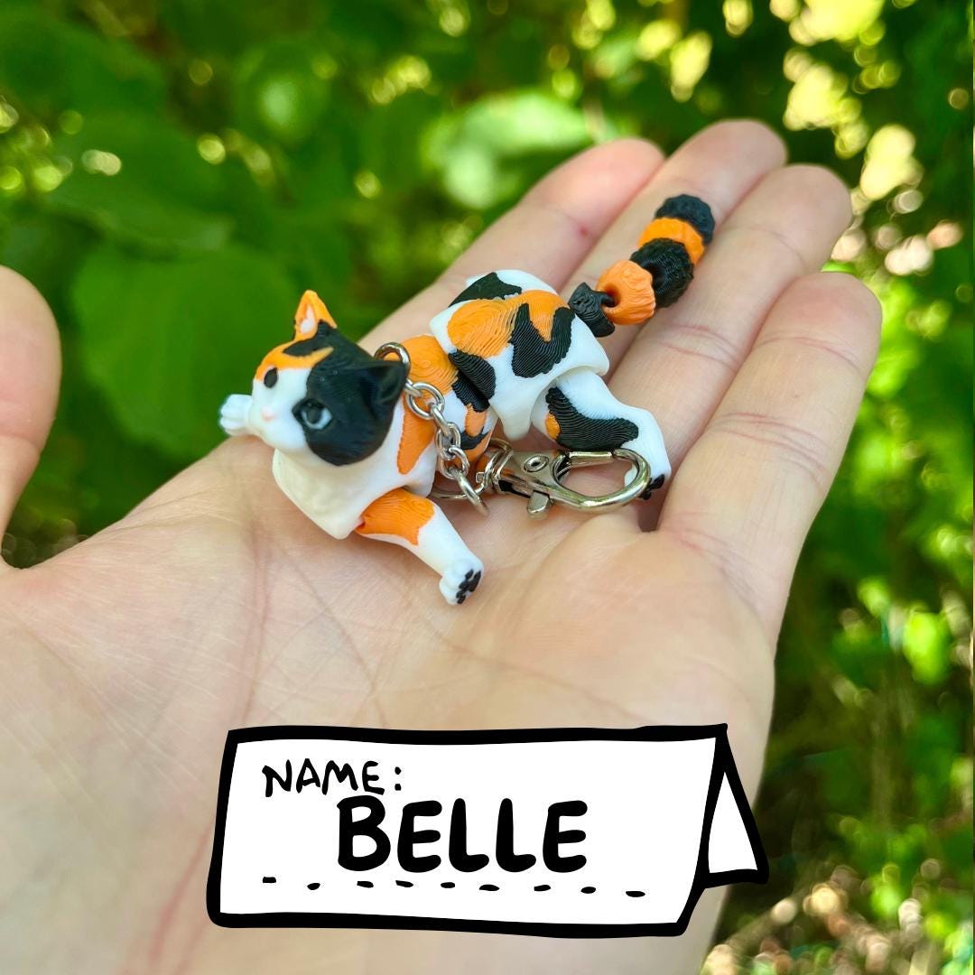 Articulated calico cats keychains