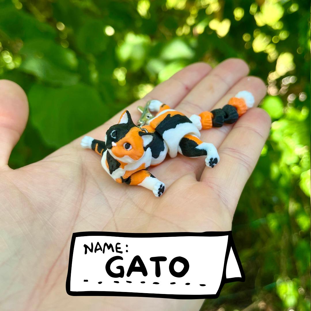 Articulated calico cats keychains