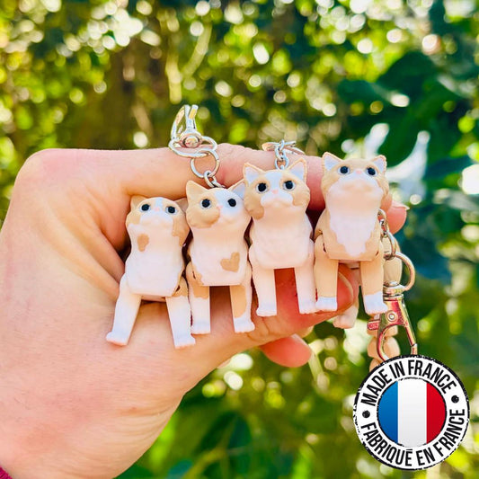 Porte-clés chats beiges articulés