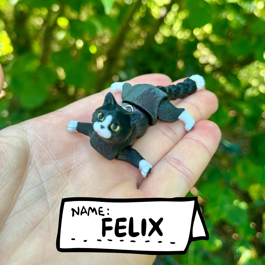 Articulated tuxedo cat keychains
