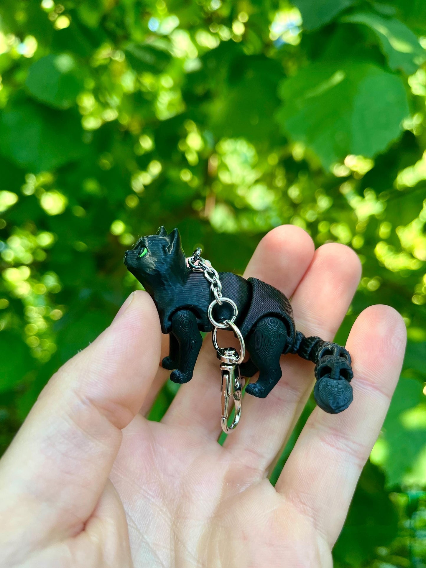 Articulated black cat keychain