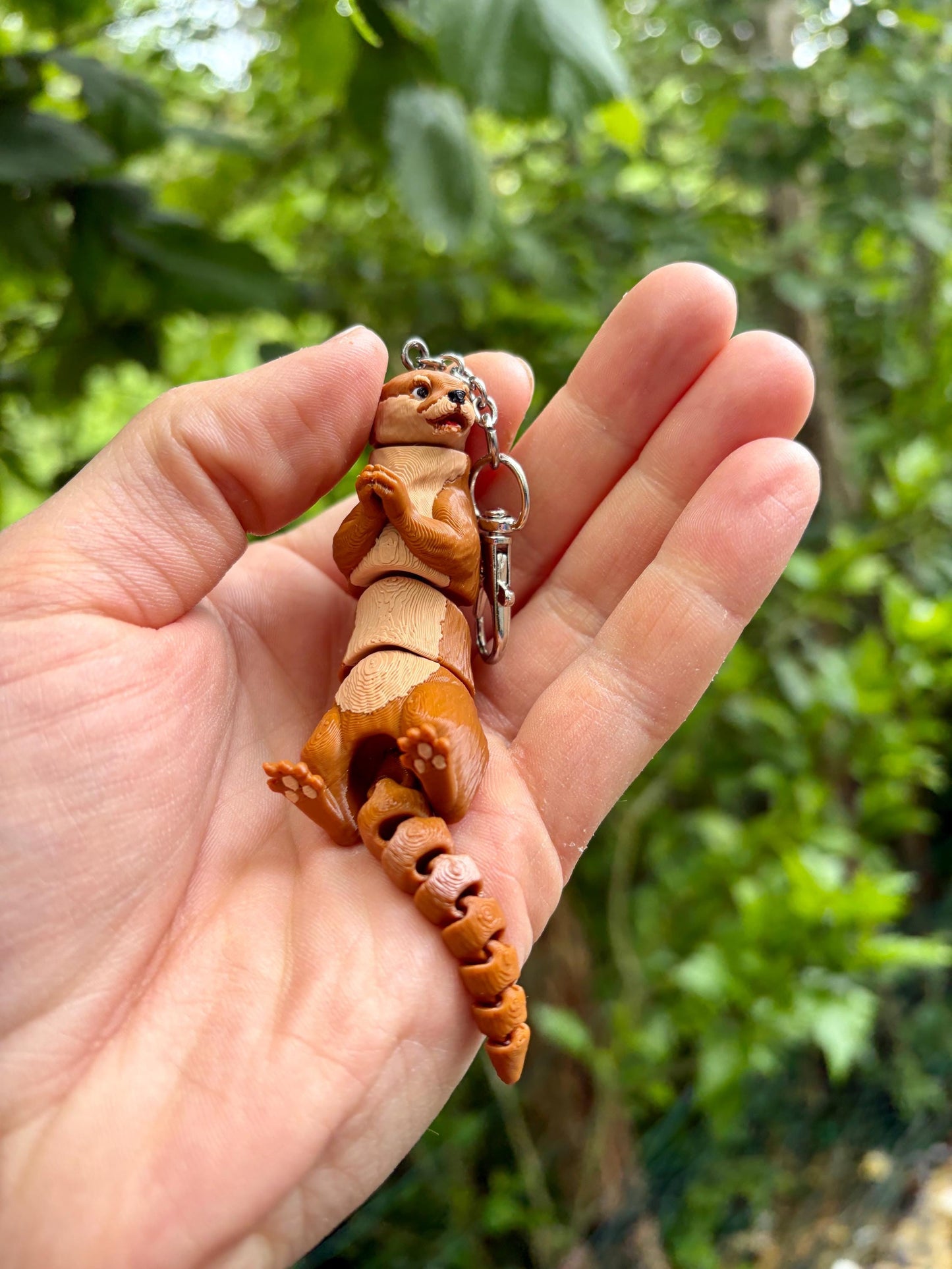 Articulated otter keychain