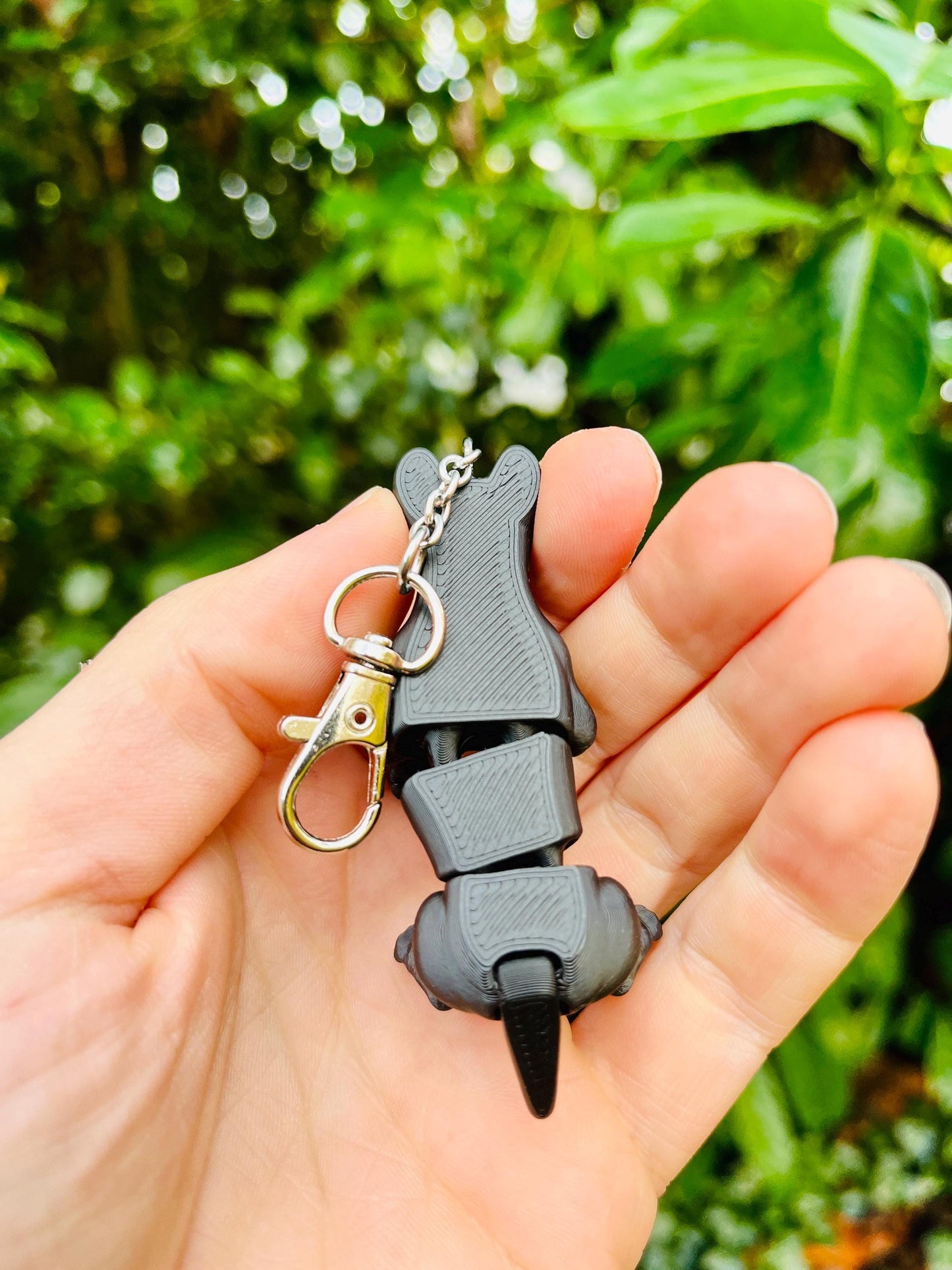 Glow-in-the-dark articulated skeleton dog keychain