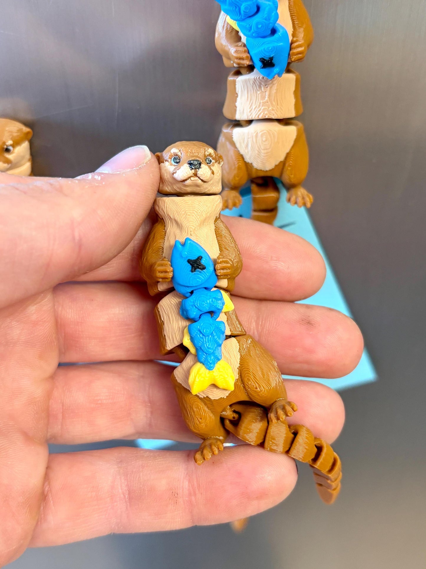Articulated otter fridge magnet